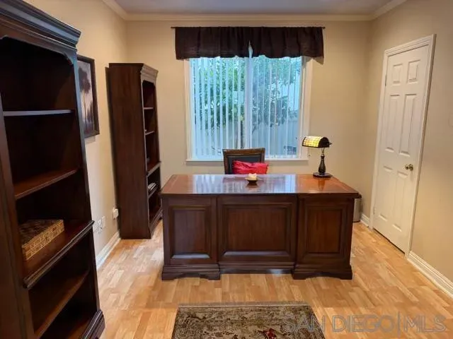 a living room with furniture and a window