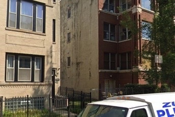 a balcony with view of the house