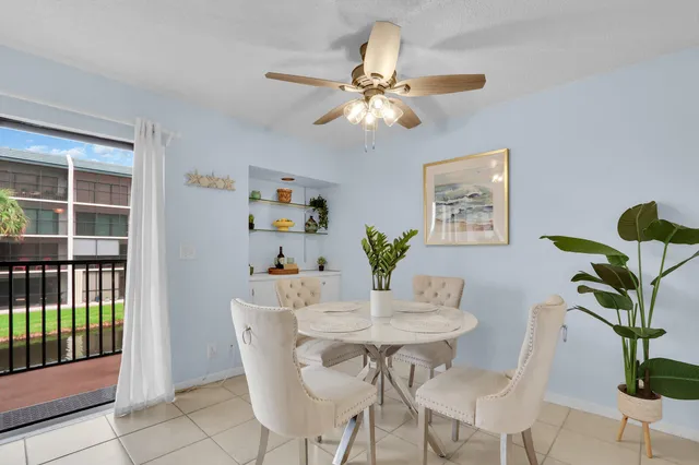 a dining room with furniture and window