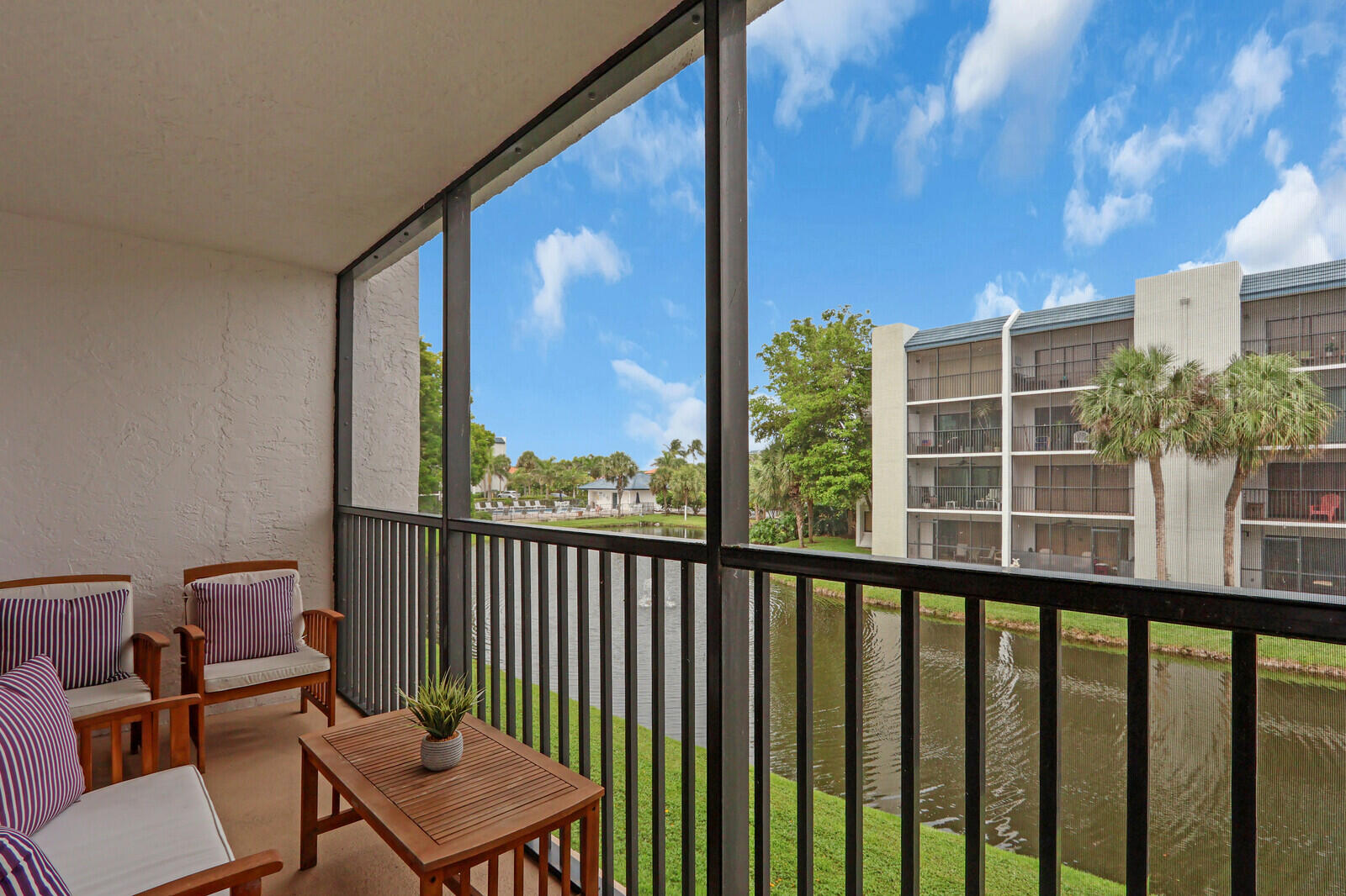 1605 Highway 1, Unit A204 Jupiter, FL 33477 - Photo 31 of 32 a view of a city from a balcony with furniture