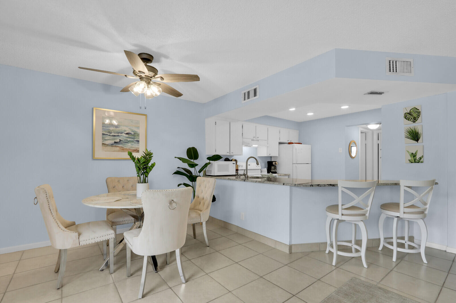 1605 Highway 1, Unit A204 Jupiter, FL 33477 - Photo 4 of 32 a view of a dining room with furniture and a chandelier