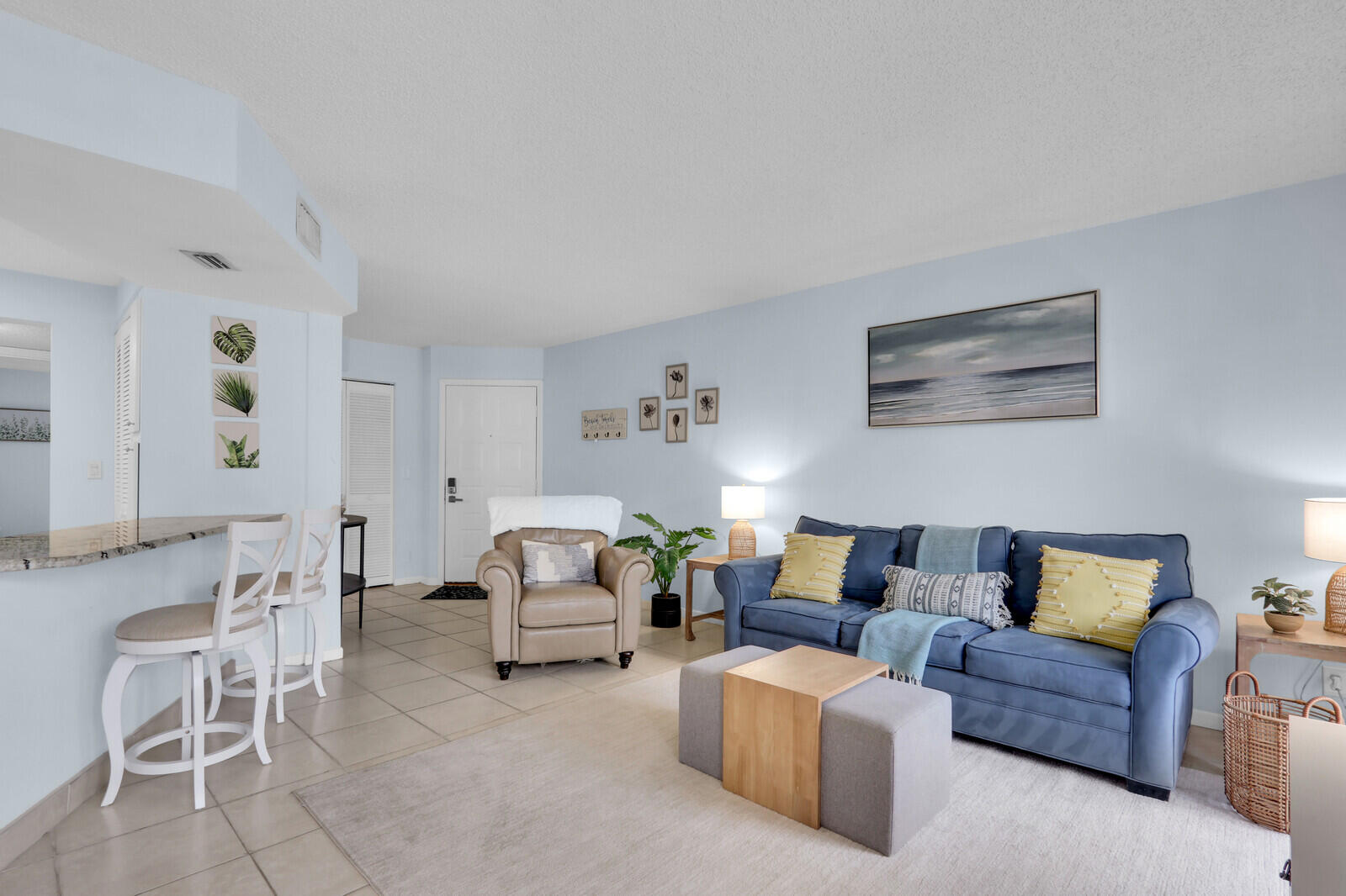 1605 Highway 1, Unit A204 Jupiter, FL 33477 - Photo 7 of 32 a living room with furniture and a couch