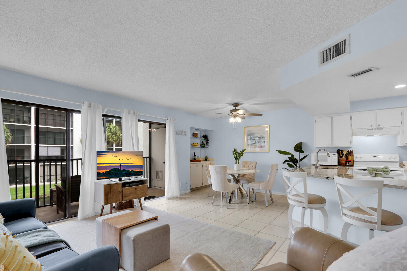 1605 Highway 1, Unit A204 Jupiter, FL 33477 - Photo 8 of 32 a living room with furniture fireplace and a window