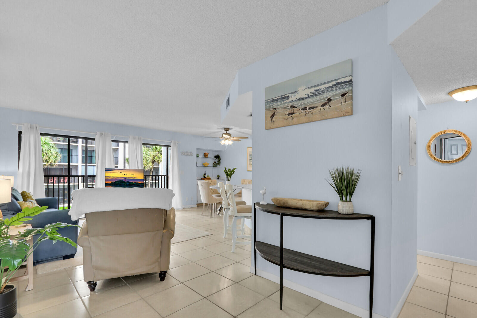 1605 Highway 1, Unit A204 Jupiter, FL 33477 - Photo 9 of 32 a living room with furniture and wooden floor