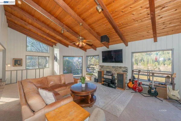 a view of a livingroom with furniture and window