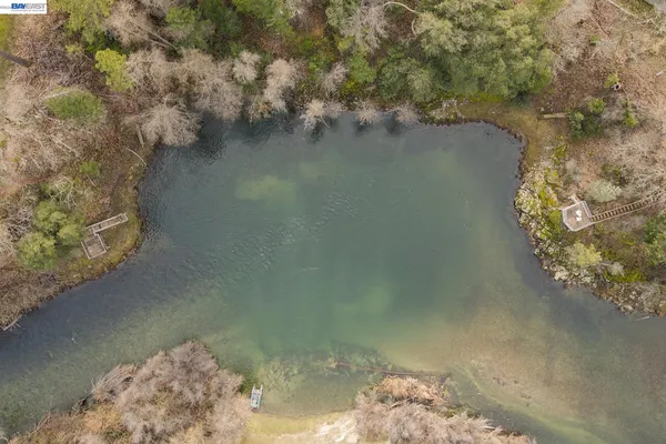 a living room with furniture large windows and a flat screen tv