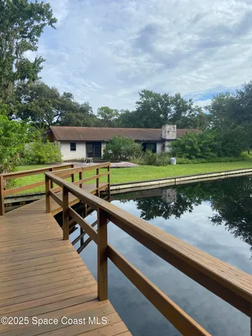 a view of swimming pool with outdoor space and lake view