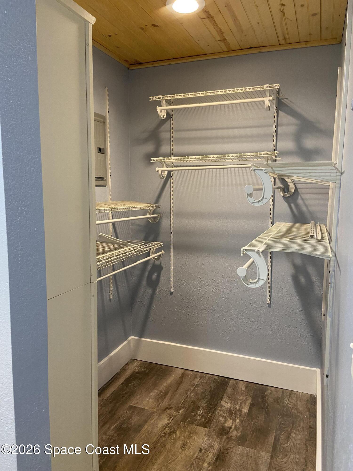 4655 Rector Road Cocoa, FL 32926 - Photo 18 of 45 a view of walk in closet with clothes and shoes