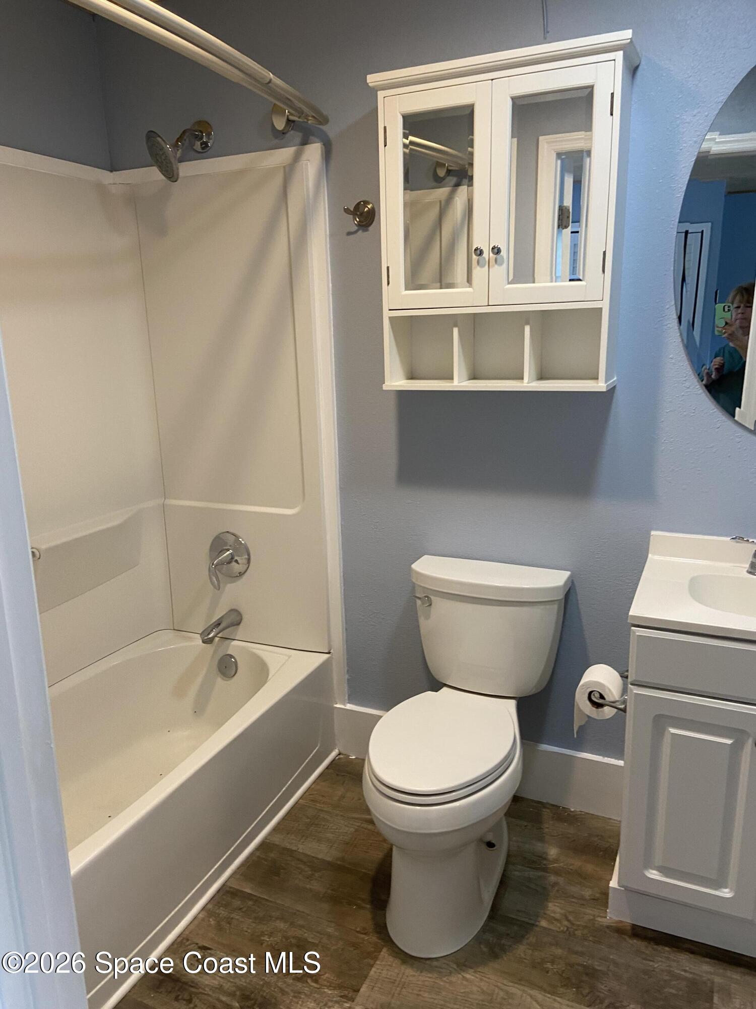 4655 Rector Road Cocoa, FL 32926 - Photo 21 of 47 a white toilet sitting next to a bath tub