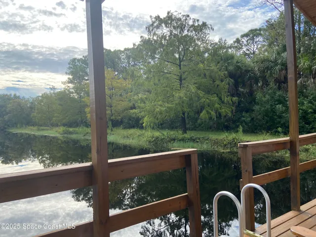 a view of a lake from a balcony