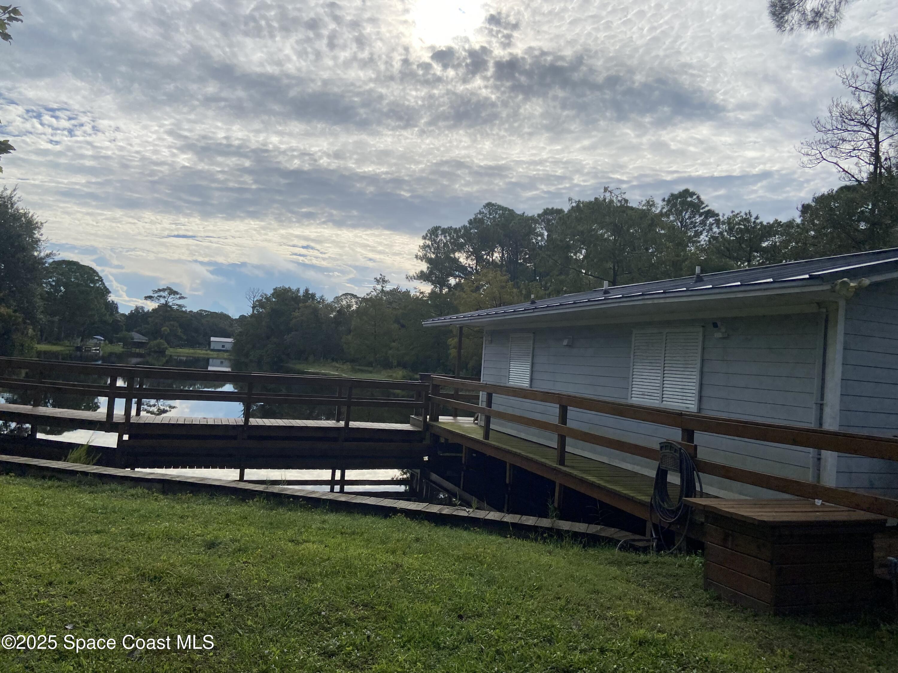 4655 Rector Road Cocoa, FL 32926 - Photo 26 of 47 a view of a bench in the garden