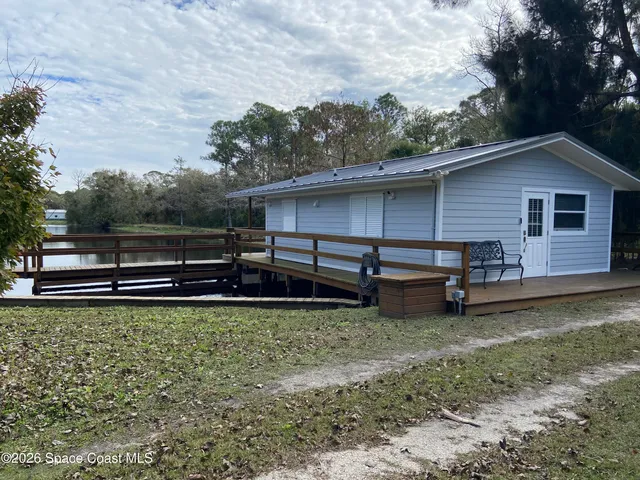 a view of a backyard with a small cabin