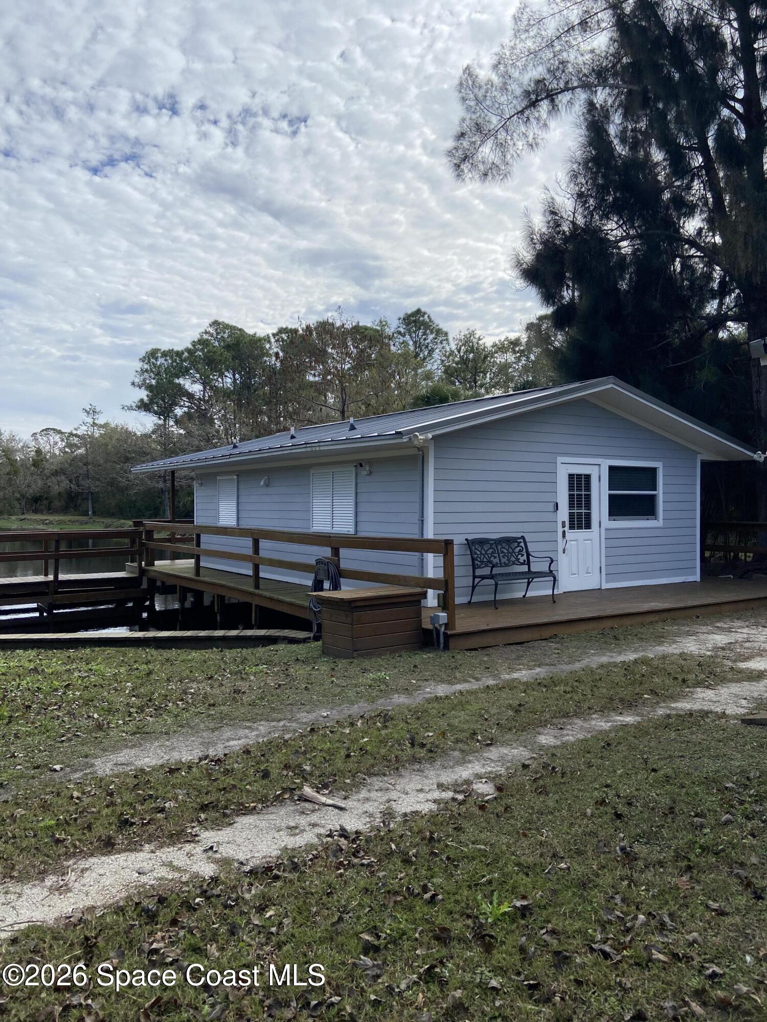 4655 Rector Road Cocoa, FL 32926 - Photo 30 of 47 a backyard of a house with barbeque oven