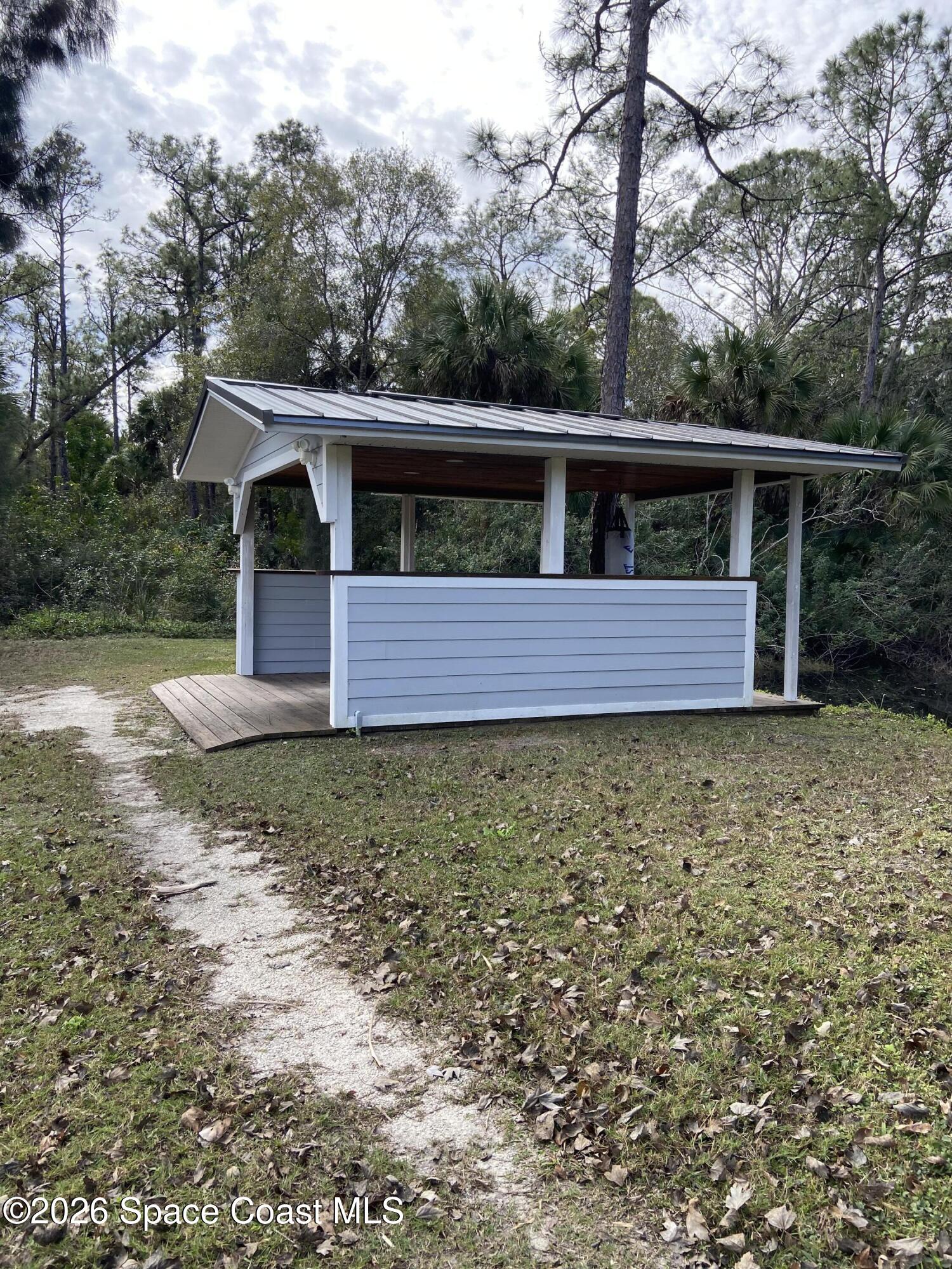 4655 Rector Road Cocoa, FL 32926 - Photo 31 of 47 a front view of a house with garden
