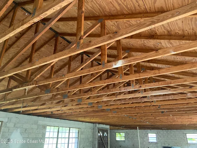 a view of a room with wooden walls and roof