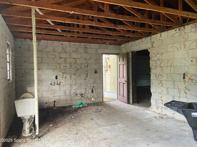 a view of a room with wooden walls