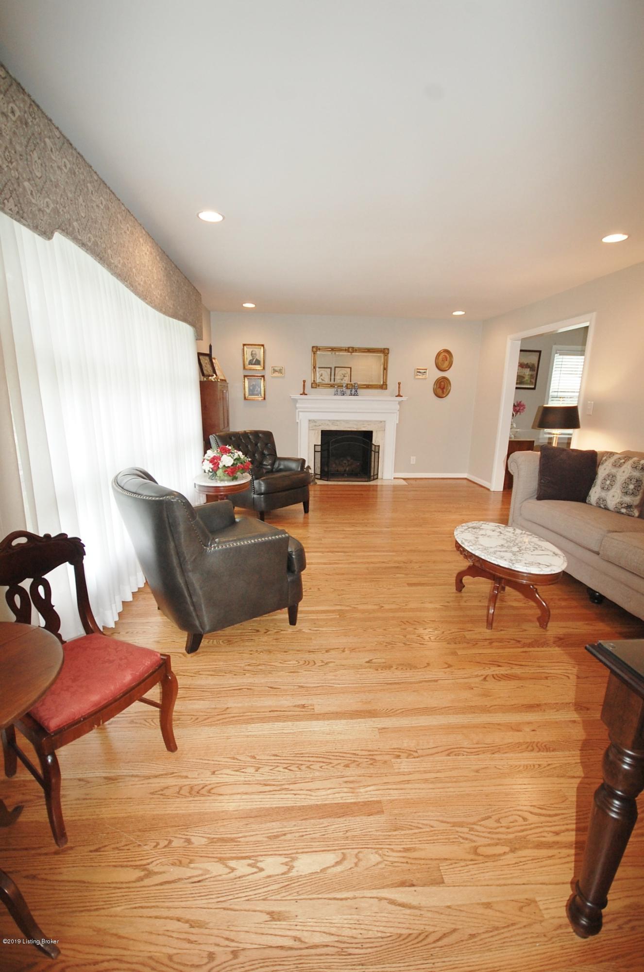 714 Antrim Road Louisville, KY 40207 - Photo 7 of 51 Large Living Room features hardwood floors and fireplace. Opening in the right is to the Dining Room