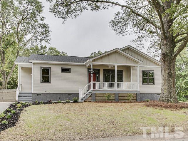 1002 Caspan Street Raleigh, NC 27610 - Photo 1 of 25 a front view of a house with garden