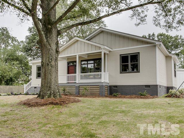 1002 Caspan Street Raleigh, NC 27610 - Photo 2 of 25 a front view of a house with a yard