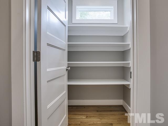1002 Caspan Street Raleigh, NC 27610 - Photo 11 of 25 a view of walk in closet with empty racks