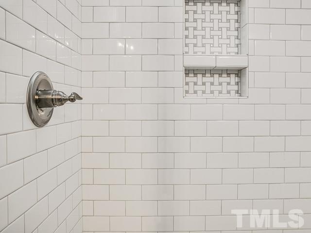 1002 Caspan Street Raleigh, NC 27610 - Photo 15 of 25 a bathroom with a shower