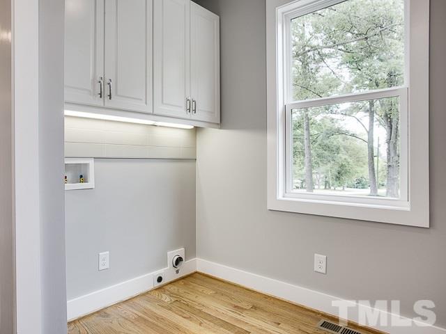 1002 Caspan Street Raleigh, NC 27610 - Photo 21 of 25 a view of a room with wooden floor and closet