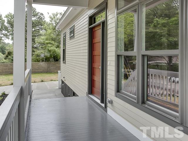 1002 Caspan Street Raleigh, NC 27610 - Photo 22 of 25 a view of a porch with wooden floor and balcony
