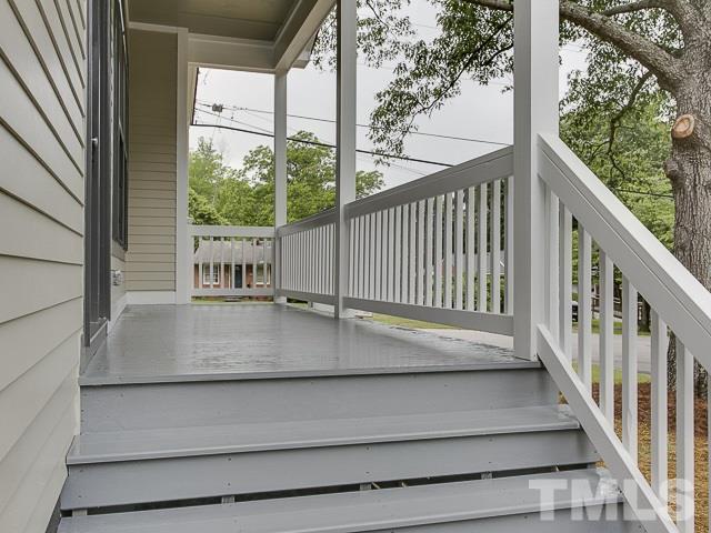 1002 Caspan Street Raleigh, NC 27610 - Photo 23 of 25 a view of a balcony with a tree