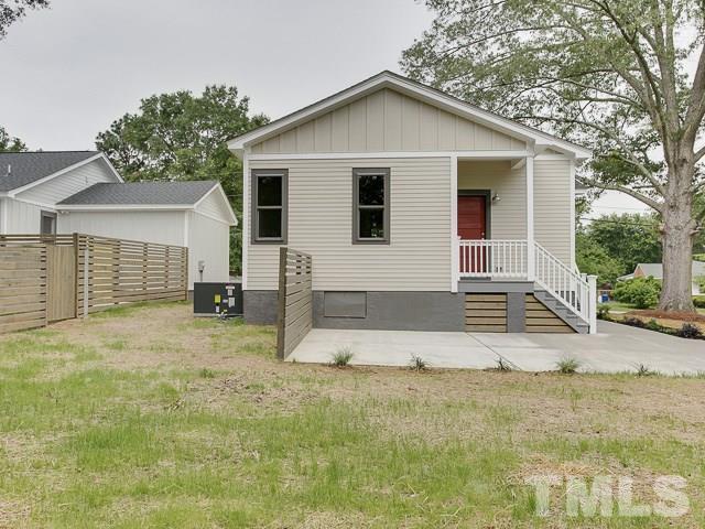 1002 Caspan Street Raleigh, NC 27610 - Photo 24 of 25 a view of a house with a yard and garage