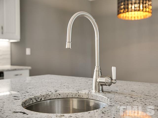 1002 Caspan Street Raleigh, NC 27610 - Photo 10 of 25 a kitchen with a sink and a window