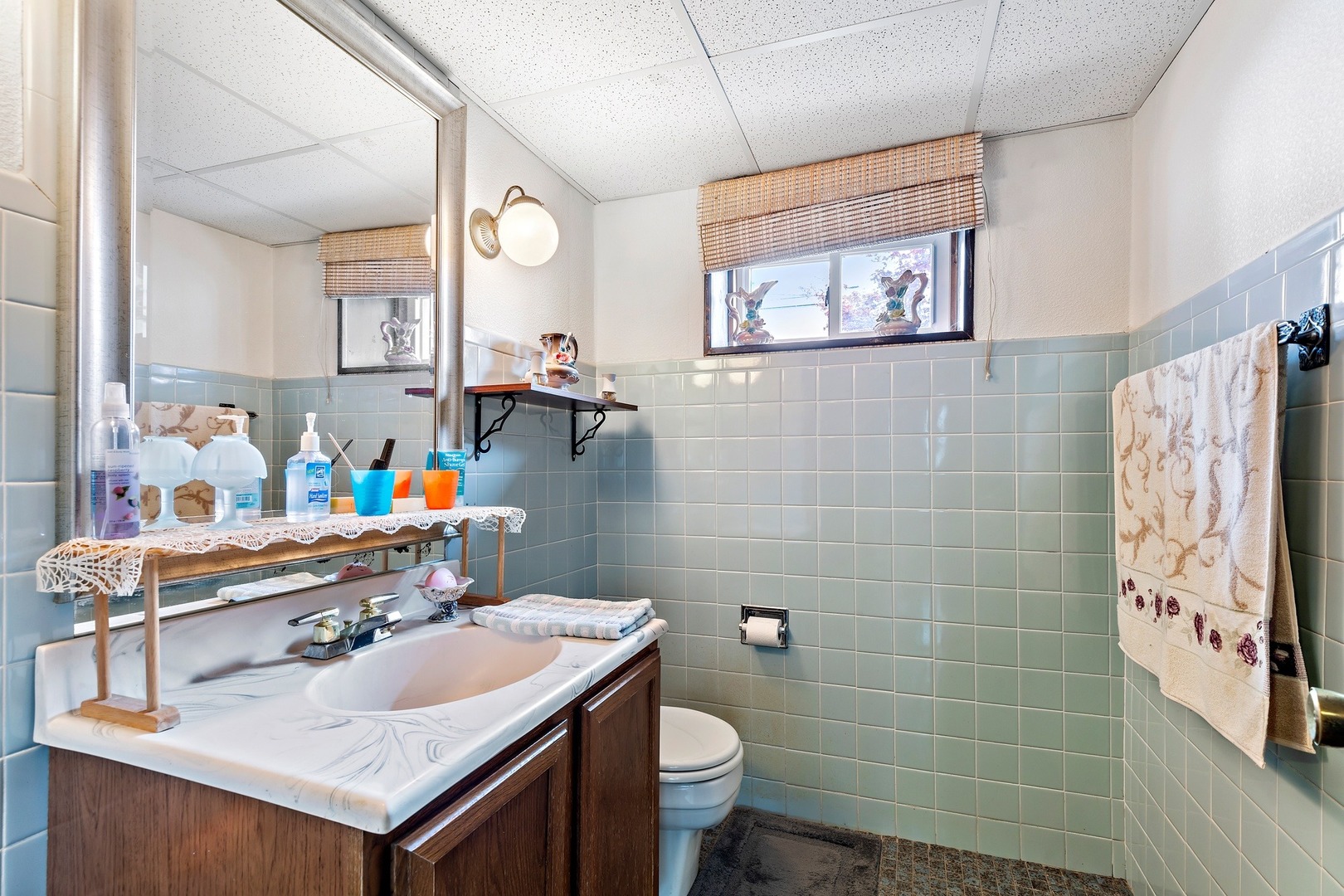216 West Plainfield Road Countryside, IL 60525 - Photo 17 of 20 a bathroom with a sink toilet and a mirror