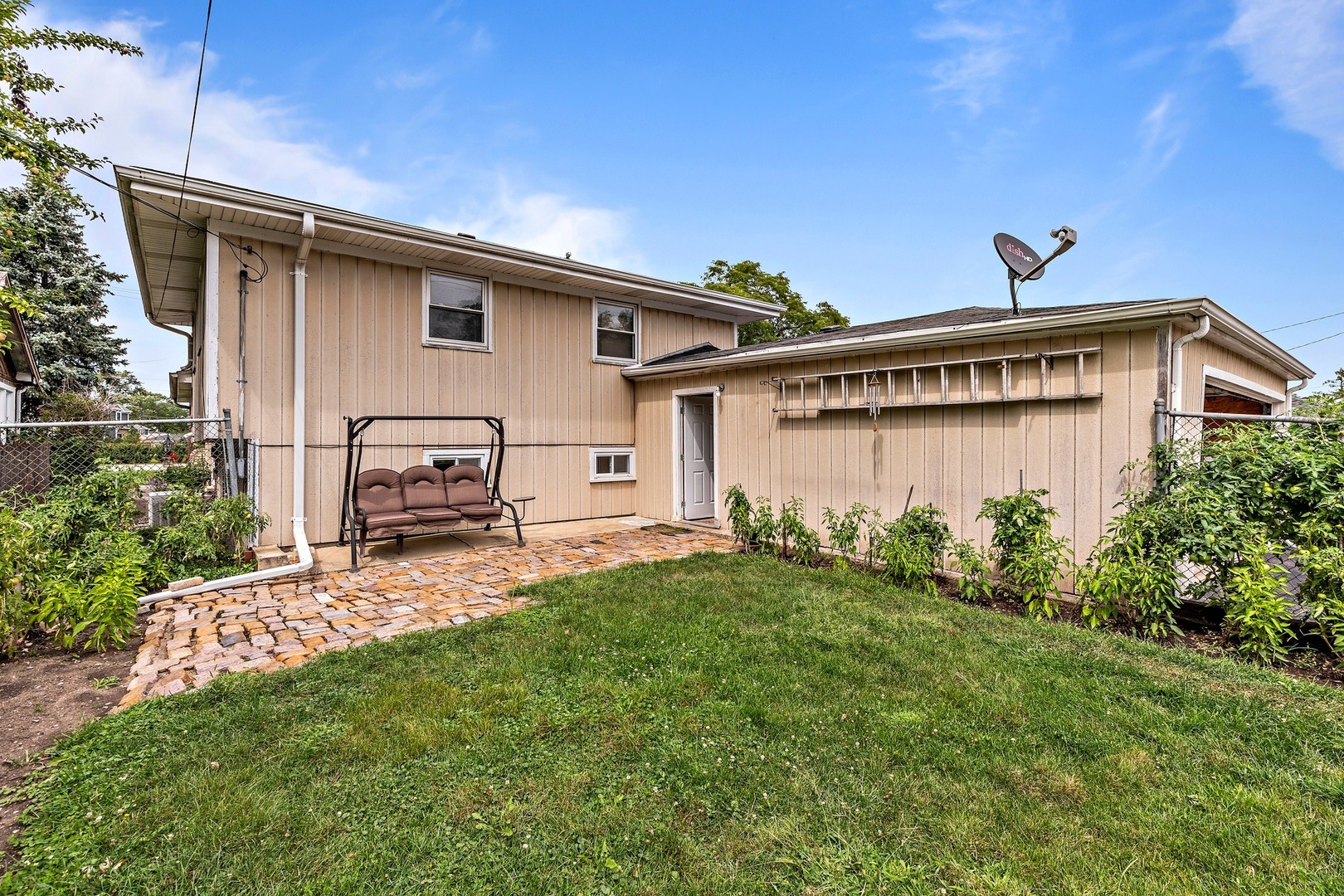 216 West Plainfield Road Countryside, IL 60525 - Photo 19 of 20 a backyard of a house with table and chairs