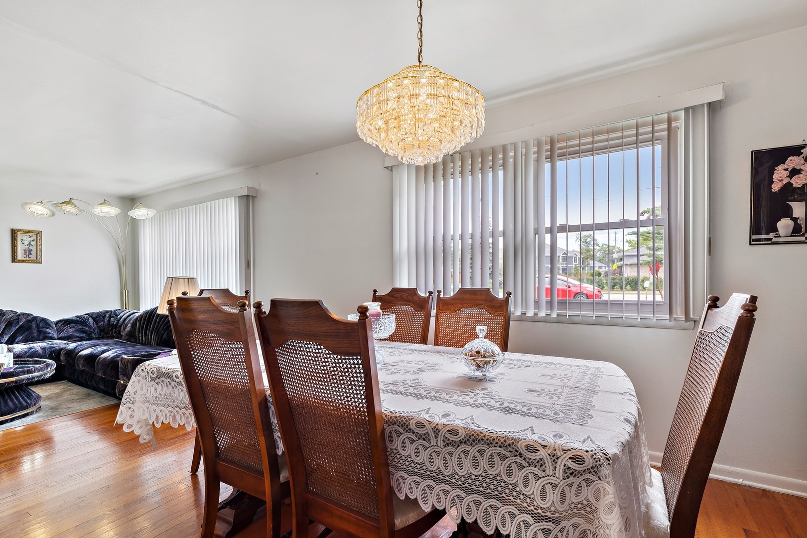 216 West Plainfield Road Countryside, IL 60525 - Photo 6 of 20 a view of a dining room with furniture a chandelier and wooden floor