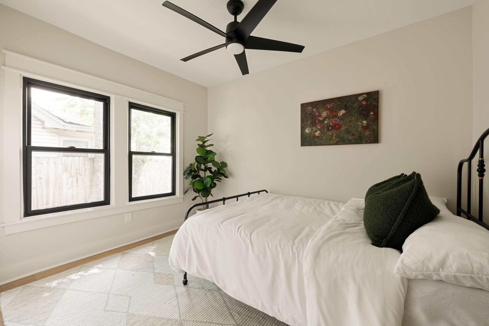 1022 Key Street Houston, TX 77009 - Photo 20 of 30 Large windows in the second bedroom invite soft, natural light to dance across the room.