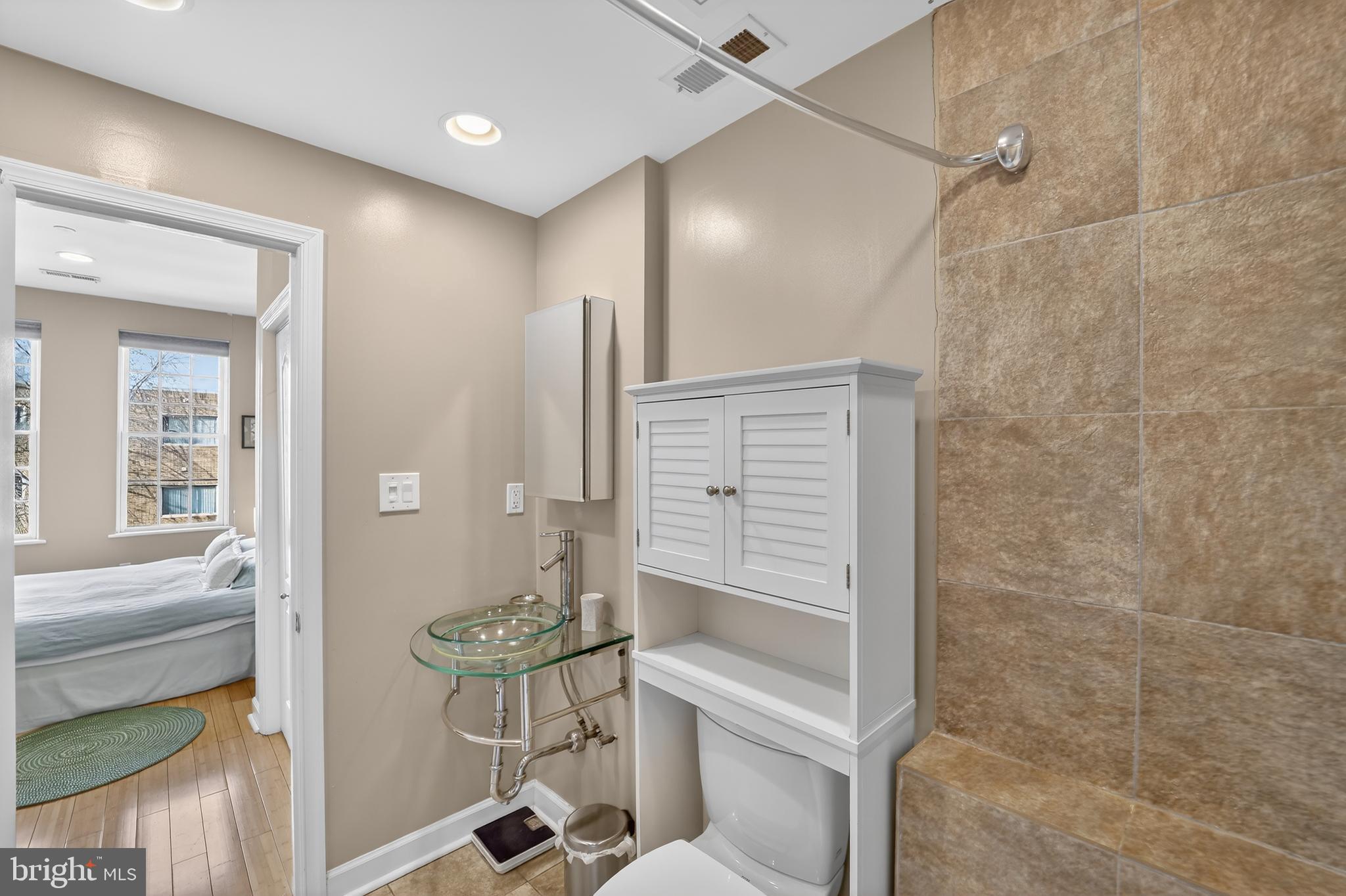 1337 Harvard Street Northwest, Unit 2 Washington, DC 20009 - Photo 11 of 23 a bathroom with a shower