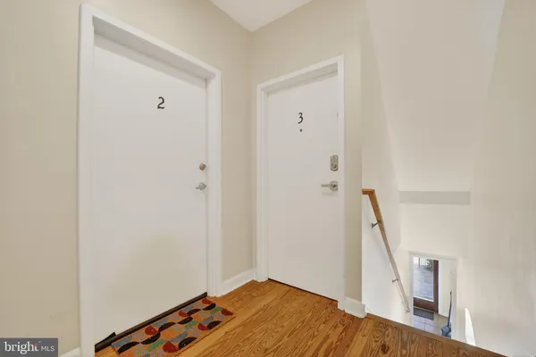 a view of a living room with wooden floor