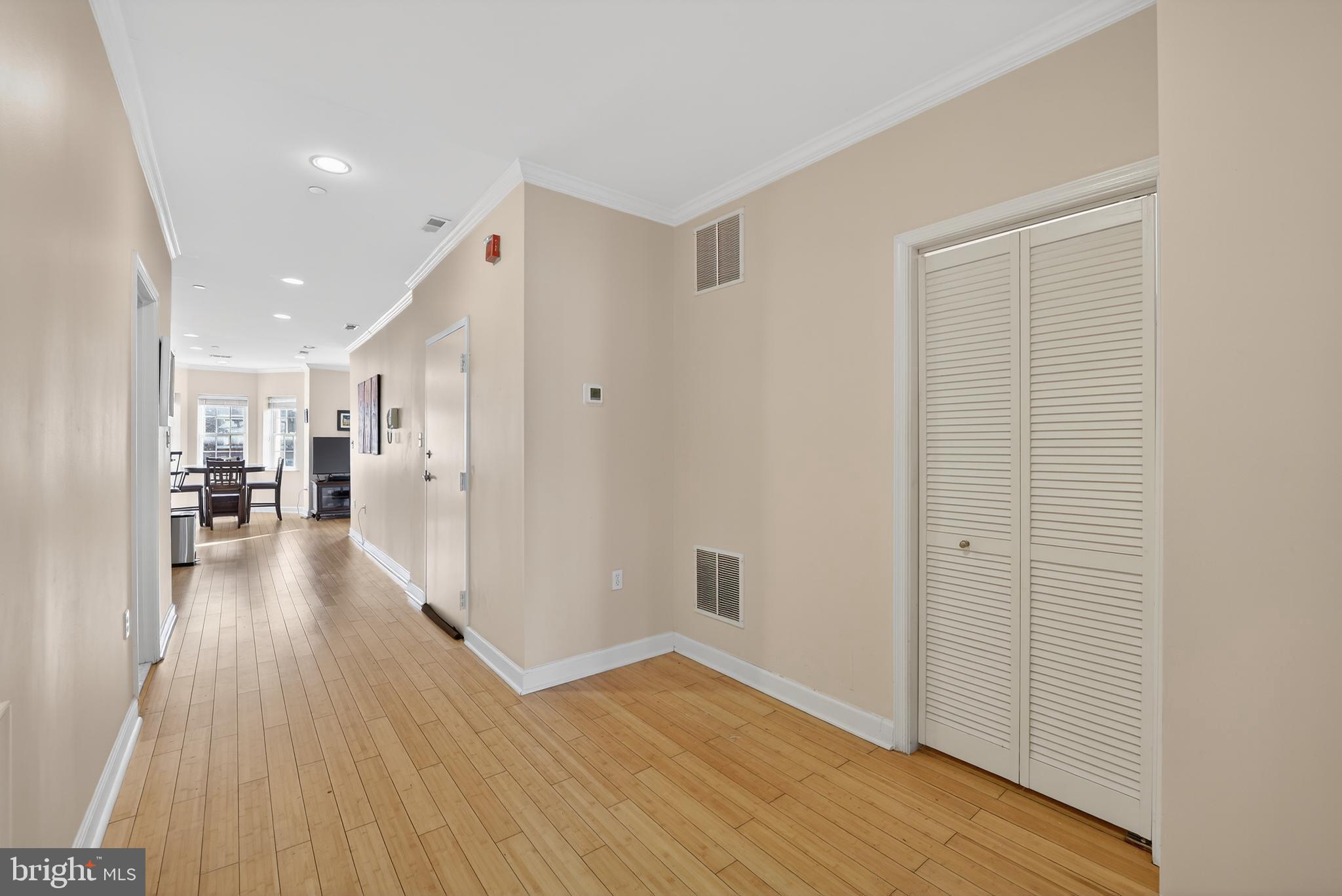 1337 Harvard Street Northwest, Unit 2 Washington, DC 20009 - Photo 2 of 23 a view of a hallway view with wooden floor and a living room