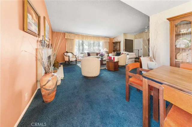 a large kitchen with stainless steel appliances kitchen island a large counter space and a window