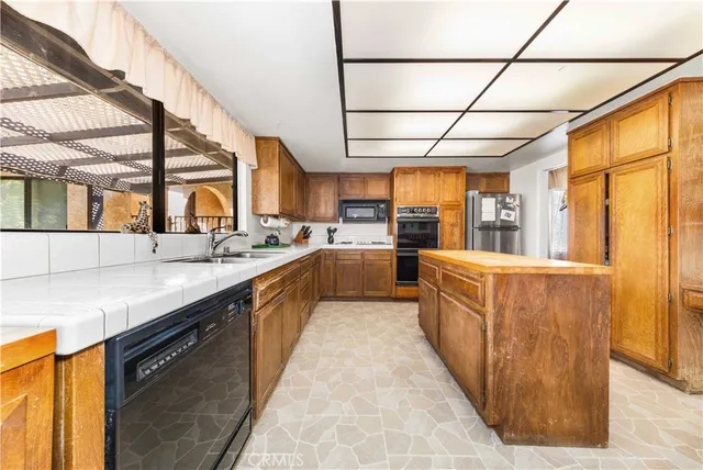 a large kitchen with a large window