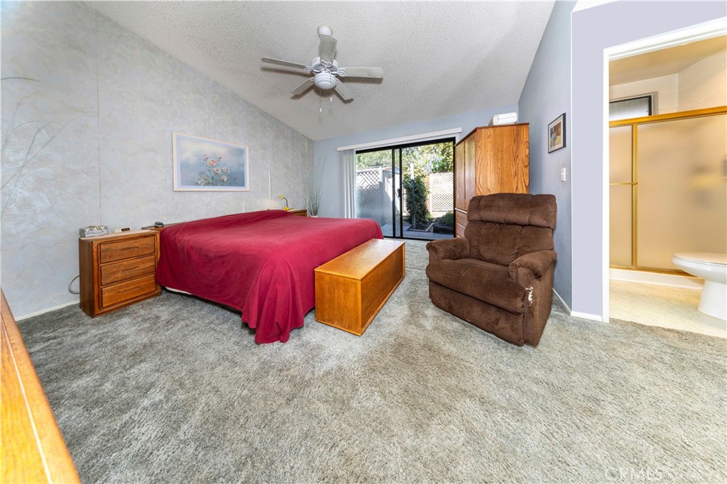 4275 Thomas Court Simi Valley, CA 93063 - Photo 29 of 59 a spacious bedroom with a bed and large windows