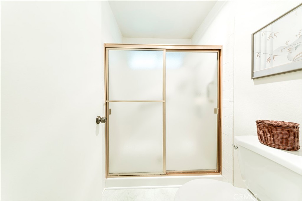 4275 Thomas Court Simi Valley, CA 93063 - Photo 40 of 59 a bathroom with a shower and a window