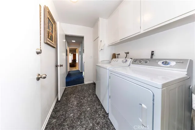 a view of a porch with furniture and a yard