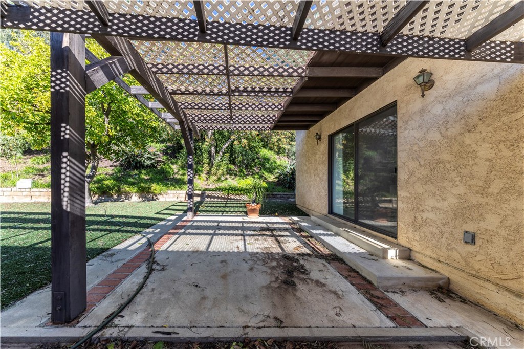 4275 Thomas Court Simi Valley, CA 93063 - Photo 45 of 59 a view of a porch with a wooden floor and a yard