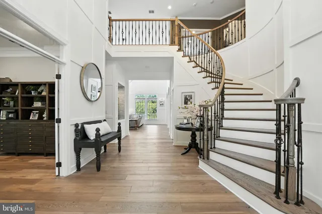 a living room with fireplace furniture and a large window