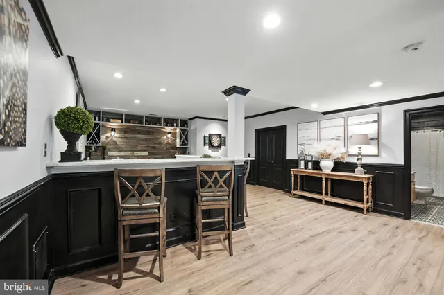a bathroom with a granite countertop sink a toilet and shower