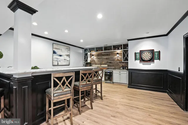 a view of backyard with seating space and wooden floor