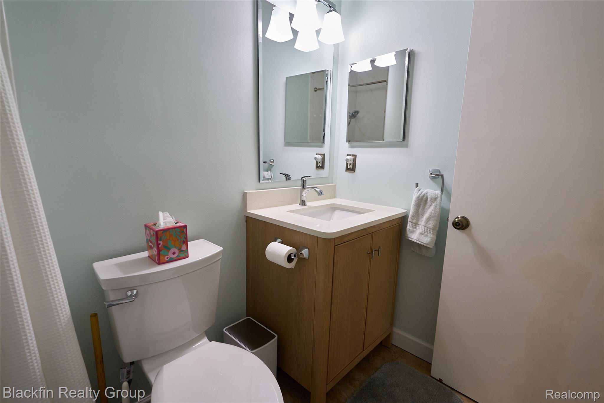 22625 Martin Road St. Clair Shores, MI 48081 - Photo 16 of 23 Full bathroom with vanity and a shower with shower curtain