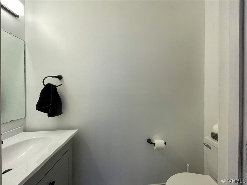 3324 Nutbush Road Victoria, VA 23974 - Photo 14 of 38 a bathroom with a sink and mirror with toilet