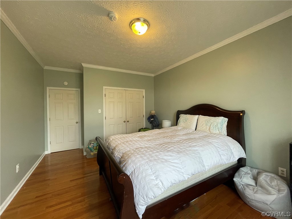3324 Nutbush Road Victoria, VA 23974 - Photo 25 of 38 a bedroom with a bed and a lamp on dresser
