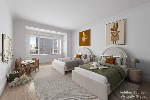 a bedroom with two beds and a couch